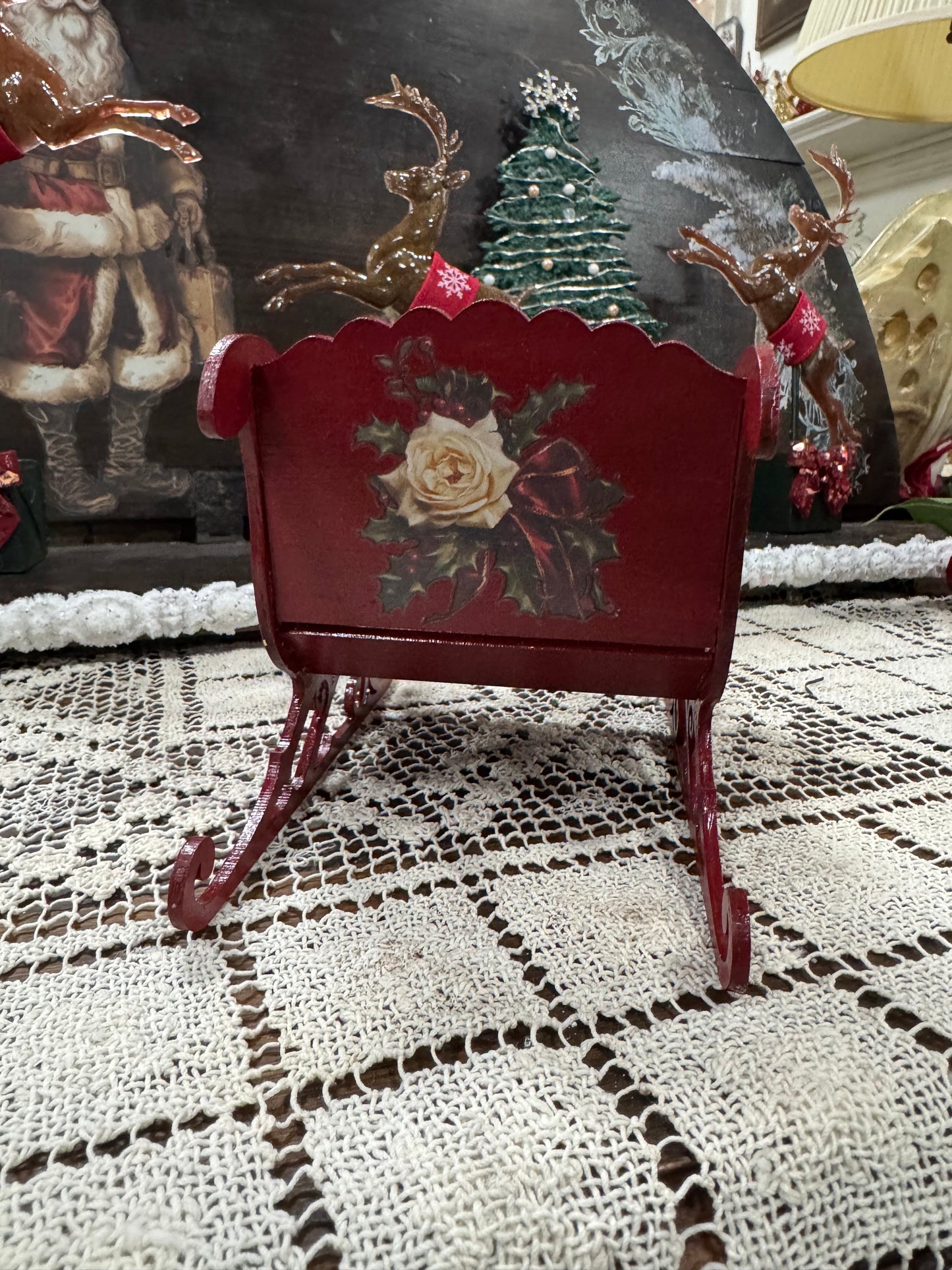 Red Christmas Santa’s Sleigh decor display Roses and flourishes