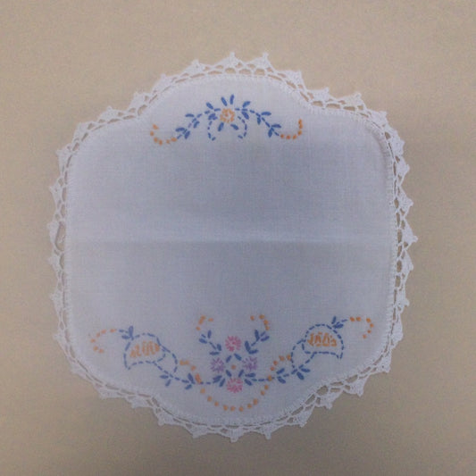 Doily-Quatrefoil embroidered linen with crocheted edge and